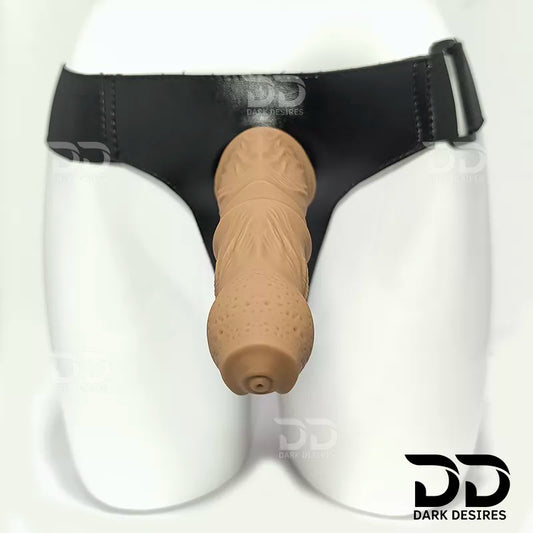 7.5 inch strap-on dildo with balls in a natural brown tone, with detailed veins along the shaft and a realistic tip. It has a 6 inch insertable length and a 5 inch girth. buy strapon dildo online in India with a harness included at DarkDesires