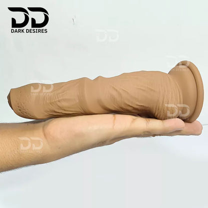 7.5 inch dildo with balls in a natural brown tone, with detailed veins along the shaft and a realistic tip. It has a 6 inch insertable length and a 5 inch girth. buy dildo online in India at DarkDesires