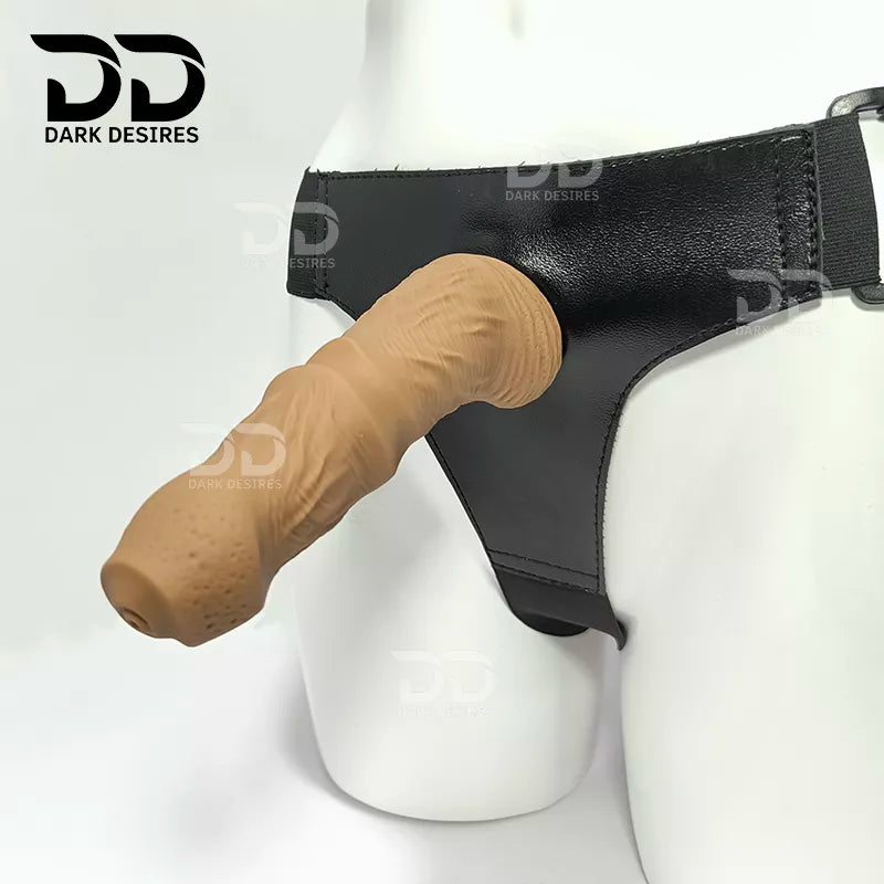7.5 inch strap-on dildo with balls in a natural brown tone, with detailed veins along the shaft and a realistic tip. It has a 6 inch insertable length and a 5 inch girth. buy strapon dildo online in India with a harness included at DarkDesires
