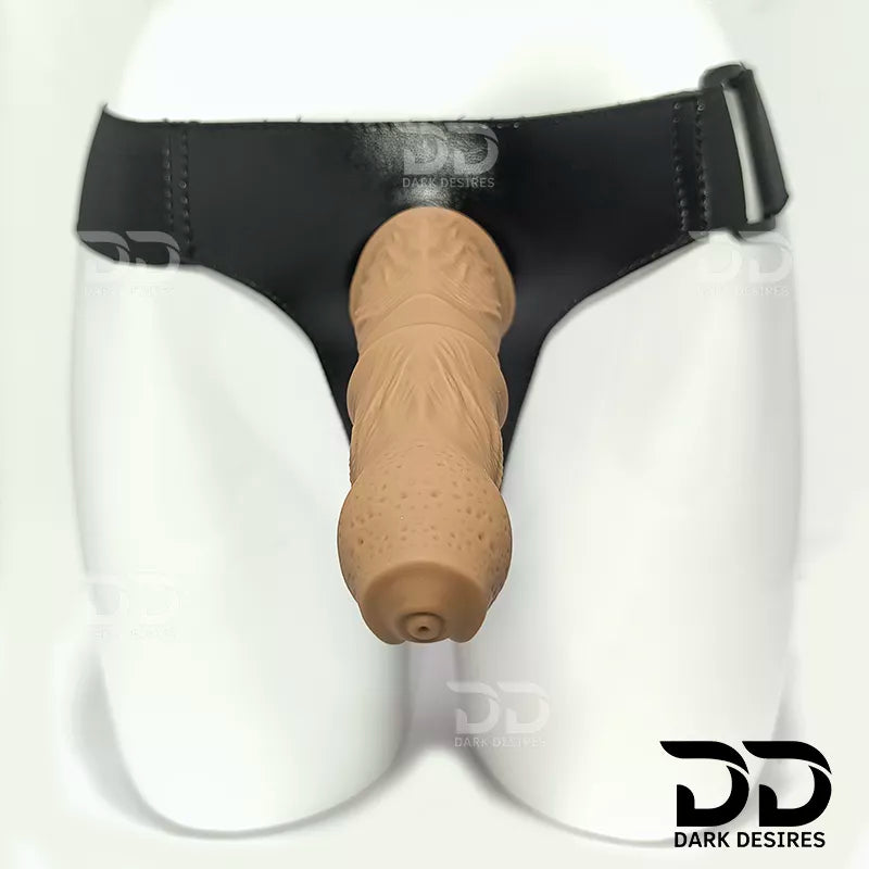 7.5 inch strap-on dildo with balls in a natural brown tone, with detailed veins along the shaft and a realistic tip. It has a 6 inch insertable length and a 5 inch girth. buy strapon dildo online in India with a harness included at DarkDesires