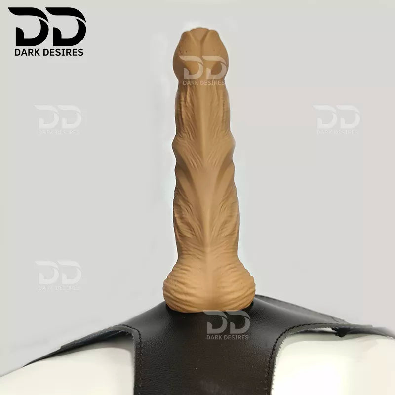 7.5 inch strap-on dildo with balls in a natural brown tone, with detailed veins along the shaft and a realistic tip. It has a 6 inch insertable length and a 5 inch girth. buy strapon dildo online in India with a harness included at DarkDesires