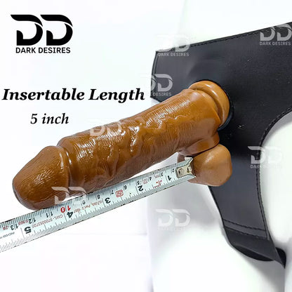 Brown textured realistic dildo shown  with a black harness, overlaid text reading 'Insertable Length 5 inch' and a measuring tape along the shaft. A realistic chocolate brown-toned dildo with a black harness-style base Black faux leather harness with an adjustable strap and a skin tone realistic dildo protruding from the front, displayed 7 inch realistic strapon dildo with adjustable harness kit for  for pegging . Lifelike veins, sculpted balls, chocolate brown tone, soft glans.  Black faux leather belt Sex