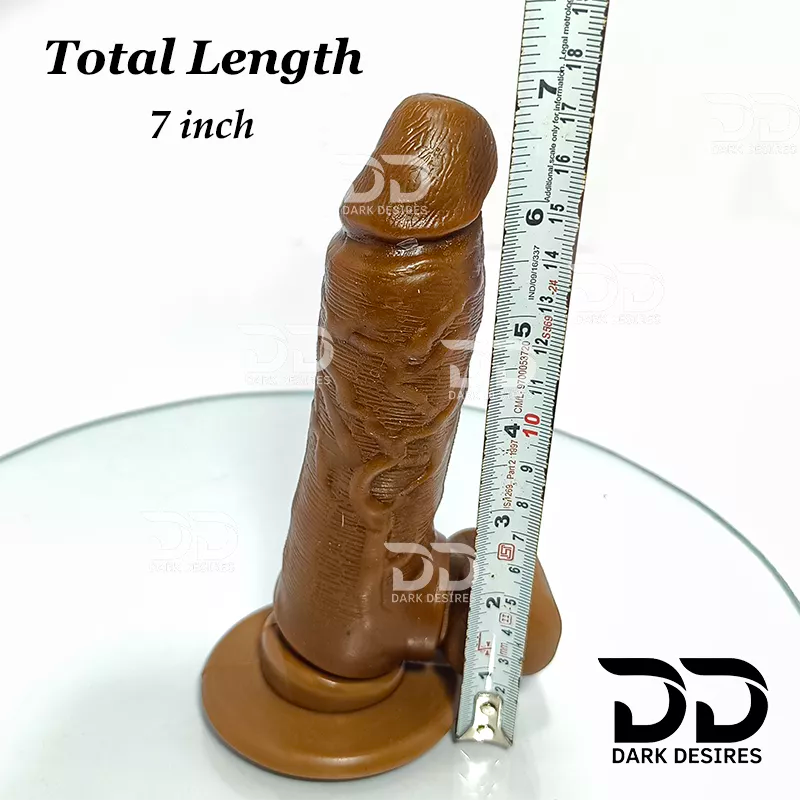 A brown silicone dildo on a matching round base, shown next to a metal ruler for scale with text reading 'Total Length 7 inch' and A realistic chocolate brown-toned dildo with a black harness-style base Black faux leather harness with an adjustable strap and a skin tone realistic dildo protruding from the front, displayed 7 inch realistic strapon dildo with adjustable harness kit for  for pegging . Lifelike veins, sculpted balls, chocolate brown tone, soft glans.  Black faux leather belt Sex Toys for Women 