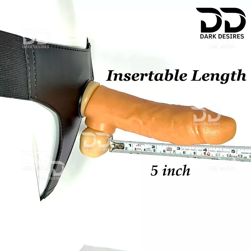An insertable adult novelty dildo shown attached to a black harness, with a measuring tape indicating a insertable length of 5 inches. A realistic skin-toned dildo with a black harness-style base Black faux leather harness with an adjustable strap and a skin tone realistic dildo protruding from the front, displayed 7 inch realistic strapon dildo with adjustable harness kit for  for pegging . Lifelike veins, sculpted balls, skin tone, soft glans.  Black faux leather belt Sex Toys for Women in Mumbai India by
