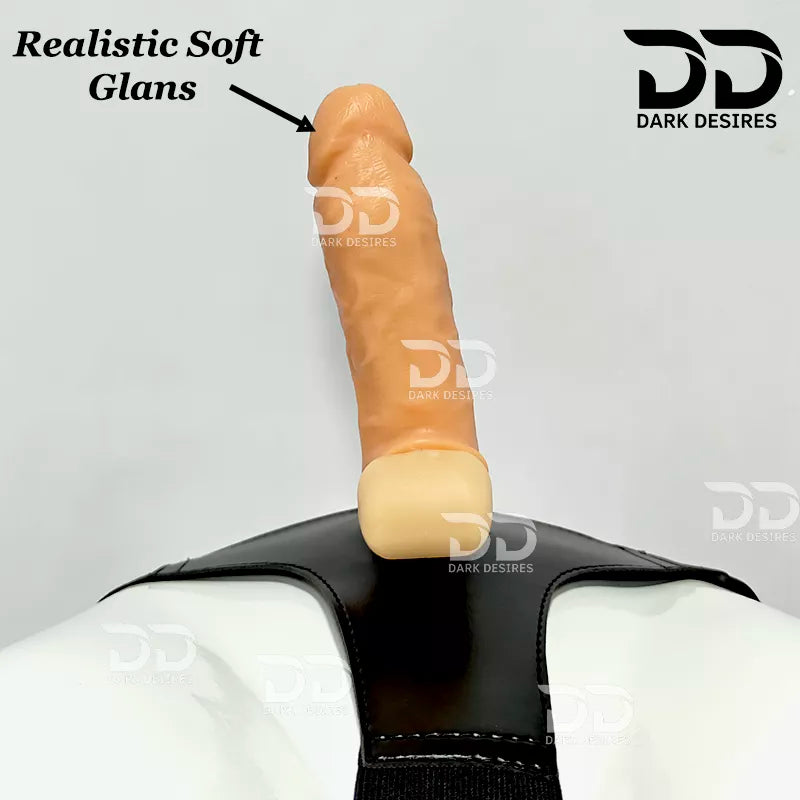 A realistic skin-toned dildo with a black harness-style base Black faux leather harness with an adjustable strap and a skin tone realistic dildo protruding from the front, displayed 7 inch realistic strapon dildo with adjustable harness kit for  for pegging . Lifelike veins, sculpted balls, skin tone, soft glans.  Black faux leather belt Sex Toys for Women in Mumbai India by DarkDesires
