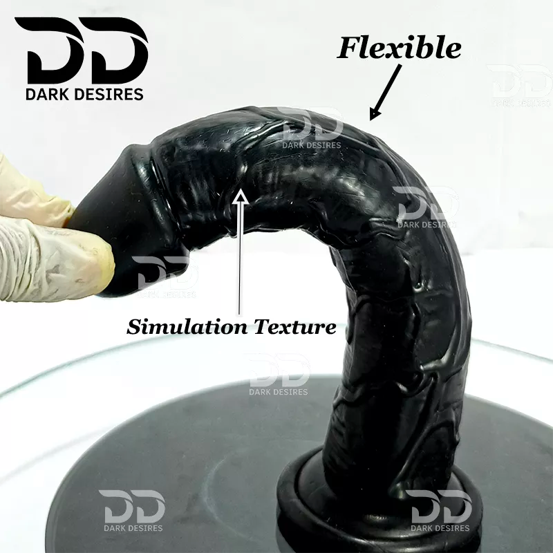 Black textured dildo shown on a black display base with a gloved hand at the flared base, 'Flexible' and 'Simulation Texture,' plus  9 inch realistic strapon dildo with adjustable harness kit for  for pegging . Lifelike veins, black tone, soft glans.  Black faux leather belt Sex Toys for Women in Mumbai India by DarkDesires
