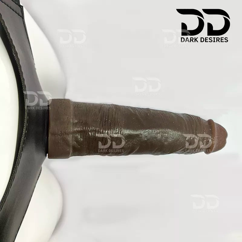 A realistic brown-toned dildo with a black harness-style base Black faux leather harness with an adjustable strap and a brown tone realistic dildo displayed 8 inch realistic strapon dildo with adjustable harness kit with balls for pegging . Lifelike veins, brown tone, soft glans.  Black faux leather belt Sex Toys for Women in Mumbai India by DarkDesires