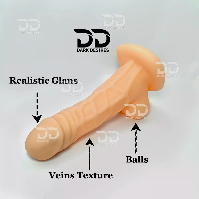 A beige realistic dildo shown on a white background with text callouts reading 'Realistic Glans,' 'Veins Texture,' and 'Balls,' hollow strapon  dildo penis sleeve extender. Adds girth and length, works pre and post-erection, harness compatible dark chocolate flesh tone color Buy Hollow Strapon dildo in India byDarkDesires